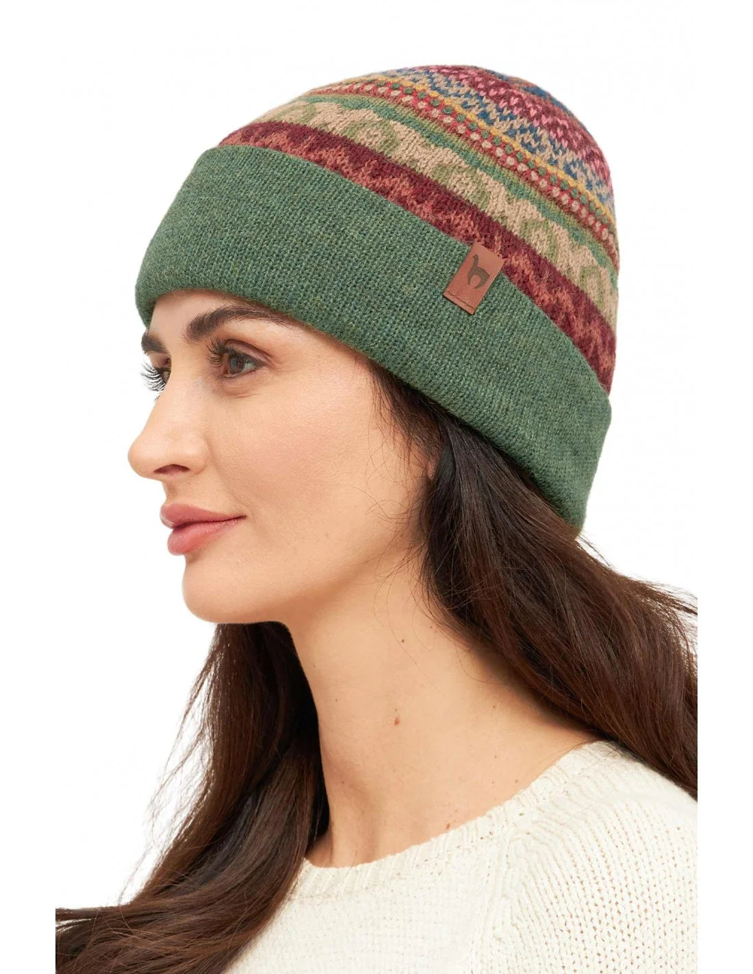 Wendemütze LUNA aus 100% Baby Alpaka – weiche, thermoregulierende Mütze mit Ethno-Muster und grüner Wendeseite